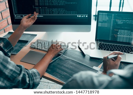 Working in the morning with businessmen are dipping coffee that works with software developers to analysis together the code written in the program on the computer. Royalty-Free Stock Photo #1447718978