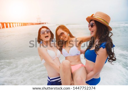 three bikini asian woman happiness with relaxing emotion in vacation sea beach