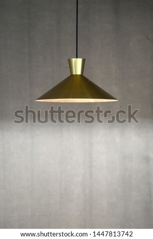 Retro lamp on gray concrete wall