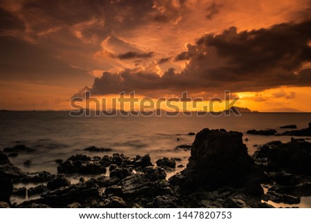 Long exposure of motion wave crashing on the rock in sunset,Koh yao yai,Phangnga,Thailand