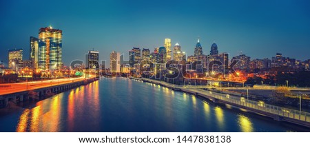 Panoramic picture of Philadelphia skyline and Schuylkill river at night, PA, USA. Royalty-Free Stock Photo #1447838138