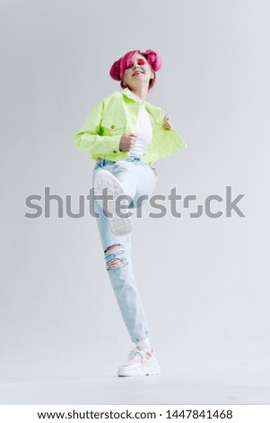 woman with pink hair in stylish clothes ripped jeans