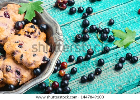 Fresh homemade berry cookies.Currant cookies on wooden table.Summer pastries