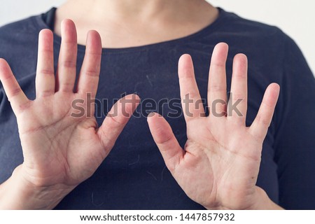 A woman making self defense gestures