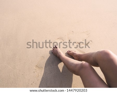 woman selfie barefoot sunbathing on sunset summer beach. 