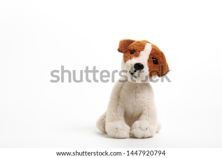 Cute jack russell dog doll isolated on white background