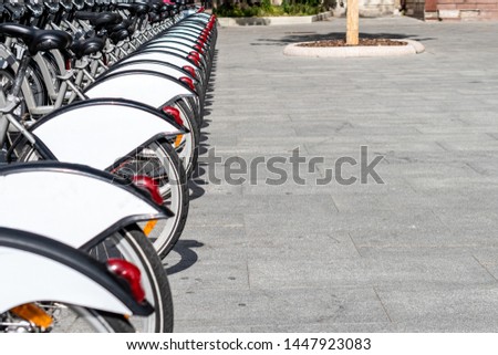 Bicycle parking on the street. Selective focus. Space for lettering or design.