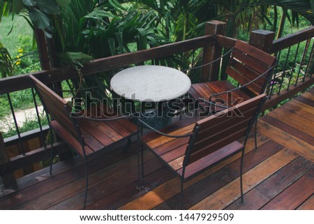 Wooden table in a green garden