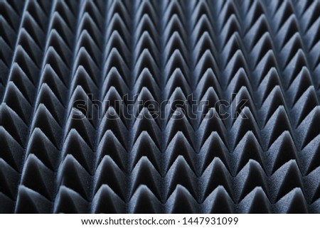 Acoustic foam rubber, soundproofing. Noise-suppressing material. Material for noise suppression in rooms and music studio. Gray triangles texture