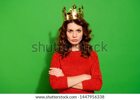 Portrait of her she nice-looking lovely winsome pretty attractive serious bossy selfish wavy-haired girl in red sweater crown feminism isolated on bright vivid shine green background Royalty-Free Stock Photo #1447956338
