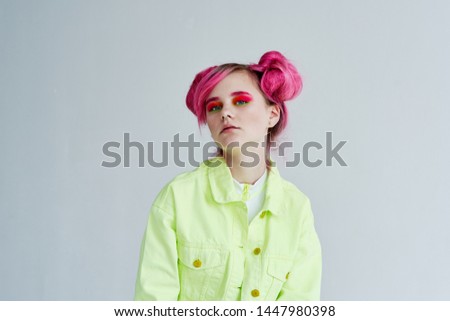 serious woman with pink hair with make-up portrait