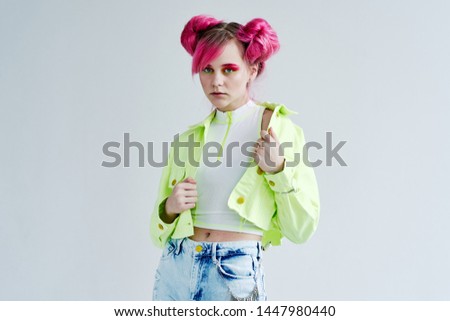 woman with pink hair serious with fashion makeup