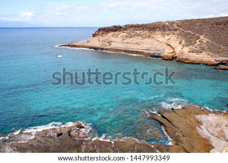 Curious rock formations on the coast, in the village of La Caleta in the South of Tenerife, Spain, Photo with space for advertising, blank space for your promotional text or advertising content,