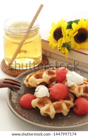 Watermelon and waffle served with cream cheese