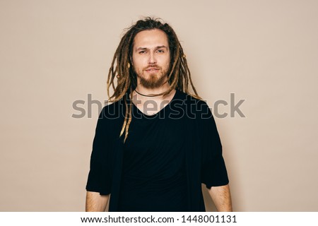 Handsome man black t-shirt dreadlocks Jamaica lifestyle music Royalty-Free Stock Photo #1448001131