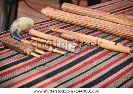 A set of ancient woodwind musical instruments. Retro pipes, flutes and horns on the table, lifestyle.