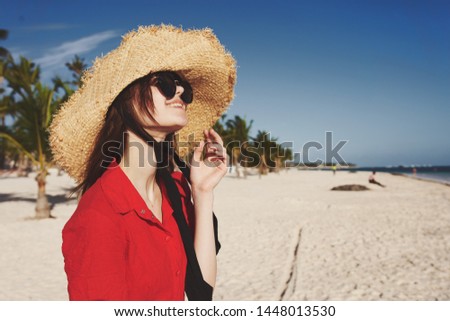  woman in a hat with glasses in summer                              