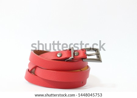 Red belt on the white floor