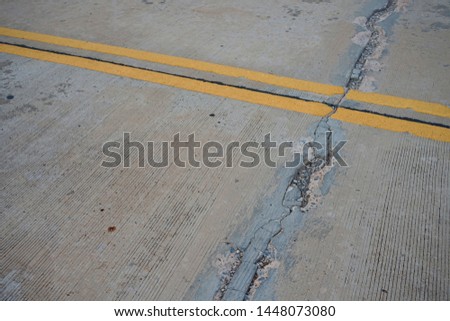 Concrete road cracks waiting for repairs Traffic route users should drive carefully.