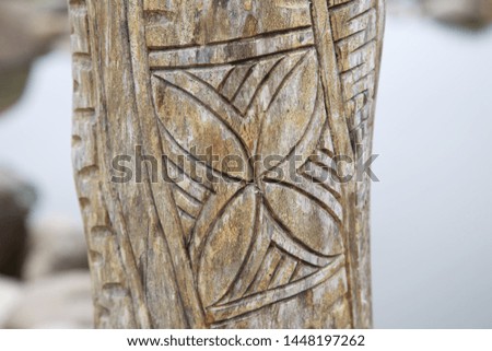 trunk with carving of a flower