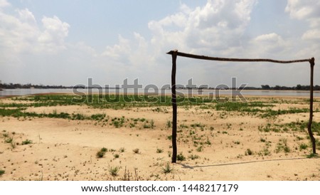 A stunning view of the sand landscape with a soccer bow on an island of the Araguaia River in Caseara, Brazil.