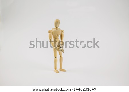Wood puppet with key.Concept of finding a way out of the situation, problem solving, solutions.