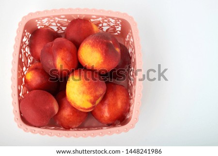 Ripe juicy nectarines isolated on white background