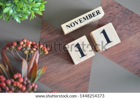 November 11. Date of November month. Diamond wood table for background.