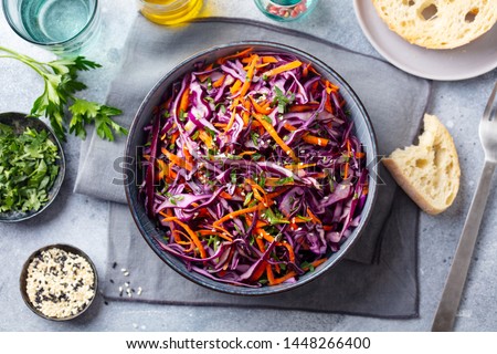 Red cabbage salad, Coleslaw in a bowl. Grey background. Top view. Royalty-Free Stock Photo #1448266400