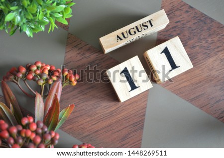 August 11. Date of August month. Diamond wood table for background.