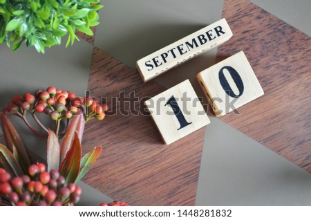 September 10. Date of September month. Diamond wood table for background.