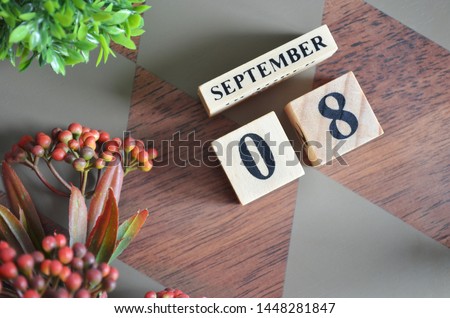 September 8. Date of September month. Diamond wood table for background.