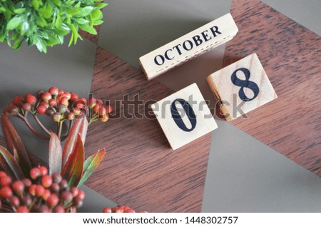 October 8. Date of October month. Diamond wood table for background.