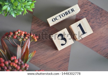 October 31. Date of October month. Diamond wood table for background.