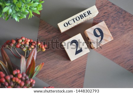 October 29. Date of October month. Diamond wood table for background.