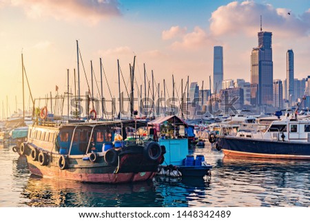 Evening view of the harbor by the city center. Hong Kong.