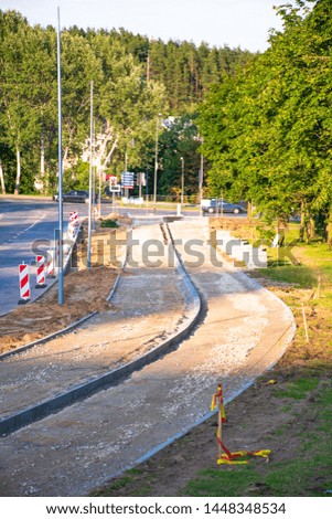 Sustainable transport. Building a new bike path with sidewalk, bicycle road under construction, vertical