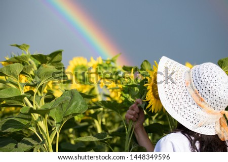 Girl Rainbow Flowers.
girl in a field with flowers on a rainbow background.