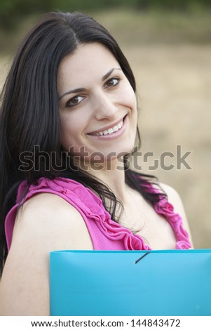 Beautiful girl with a folder