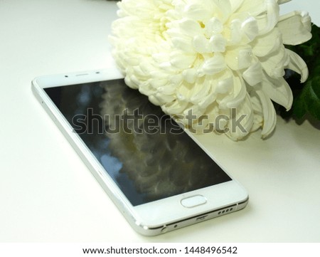 White new smart phone as chrysanthemum 