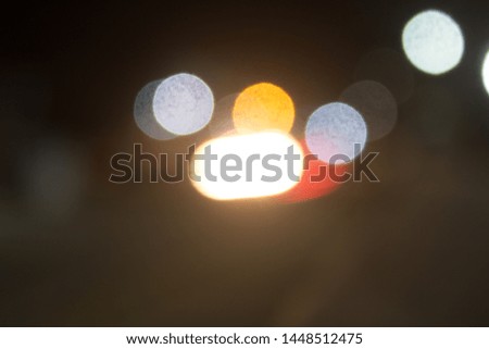 Abstract bokeh of a city in the northeastern Brazilian interior during the night. On the picture there are car lights.
