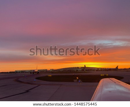 Gorgeous golden hour sky at sunrise overlooking Airport.