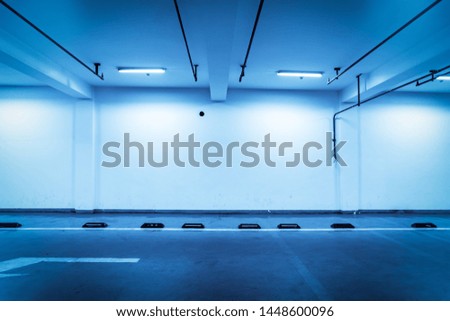 Blue tuned interior of underground parking lot

