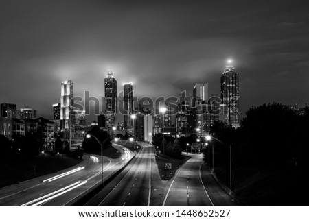 Atlanta's skyline at night covered with clouds in black and white