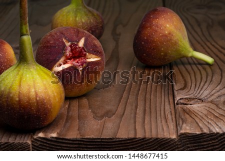 I took a picture of figs on a wooden board.