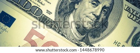 Background from banknotes of dollars and euros located.