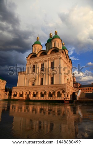 Astrakhan. Cathedral of the Assumption of the Blessed Virgin Mary. Golden domes on a background of the blue sky. Kremlin in Astrakhan, Russia. Popular touristic landmark.
