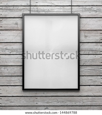 blank frame on a vintage wood wall