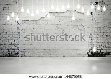 damaged brick wall with bulbs Royalty-Free Stock Photo #144870058