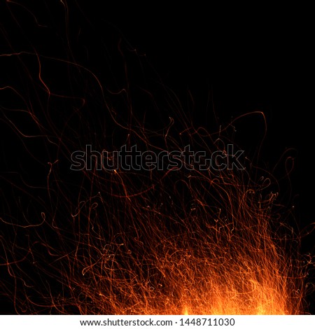 Abstract image of a fire sparks on a black background. Shot on a long exposure